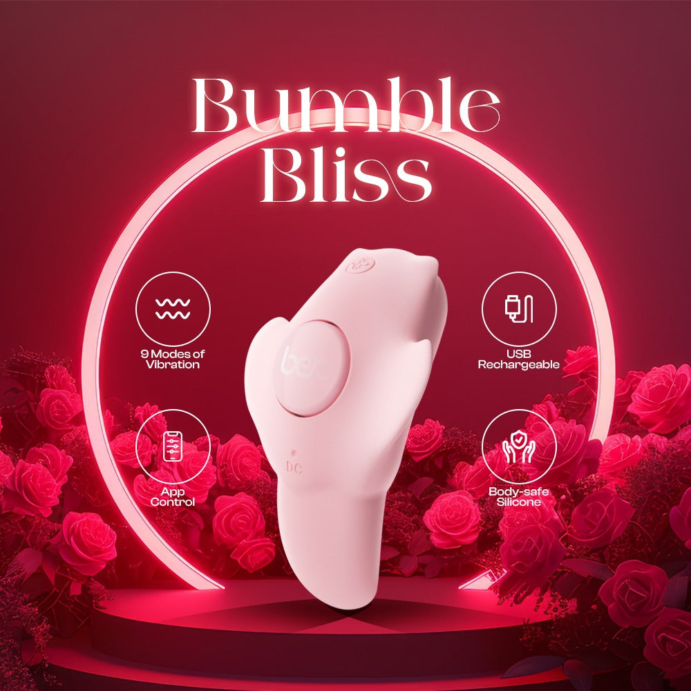 Pink wearable vibrator surrounded by red roses on a romantic themed background