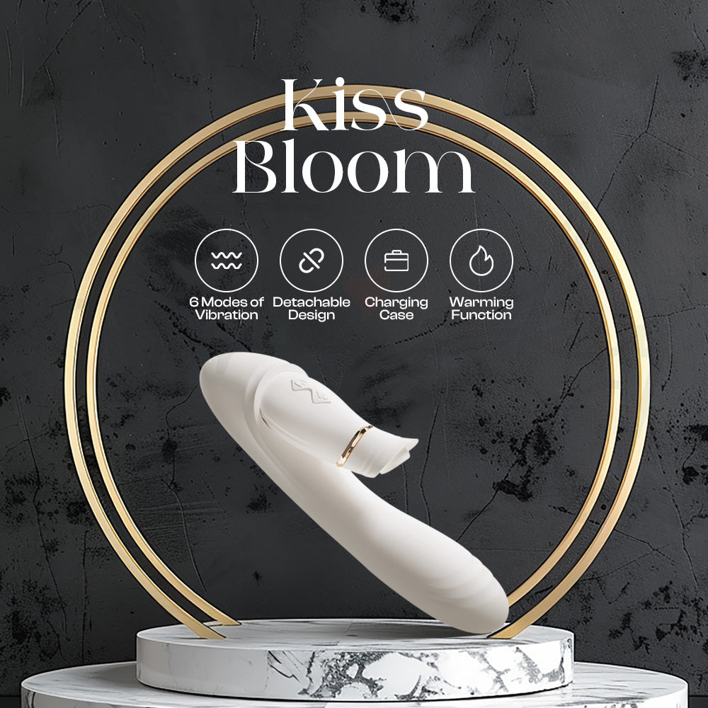 White personal massager displayed on elegant podium with Kiss Bloom branding.