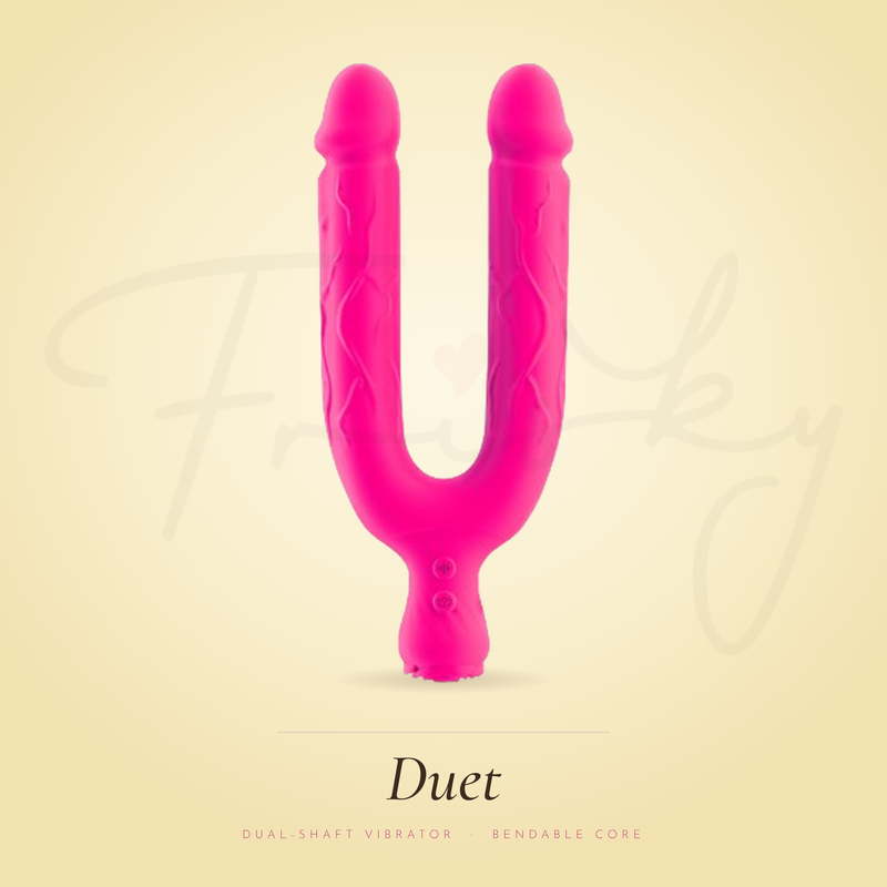 Hot pink U-shaped vibrator displayed upright against a warm yellow background