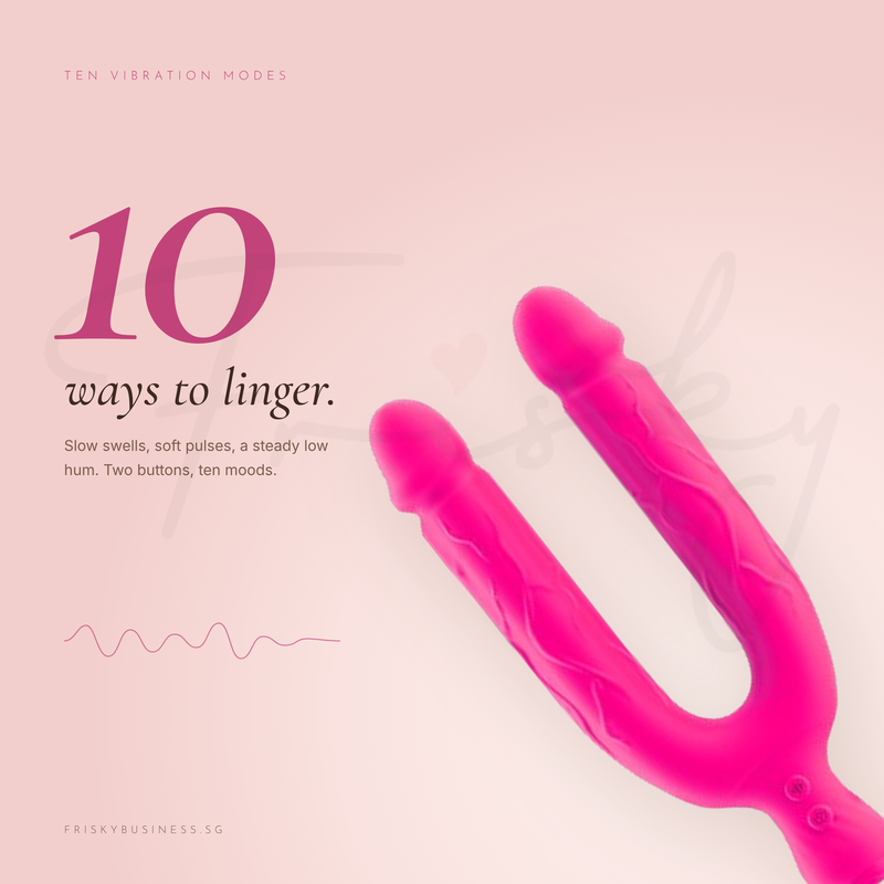 Pink vibrator tilted diagonally on a blush background beside a vibration wave