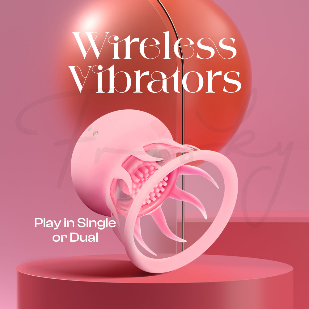 Pink jelly fish-shaped suction vibrator on a pink platform with 'Wireless Vibrators' text.