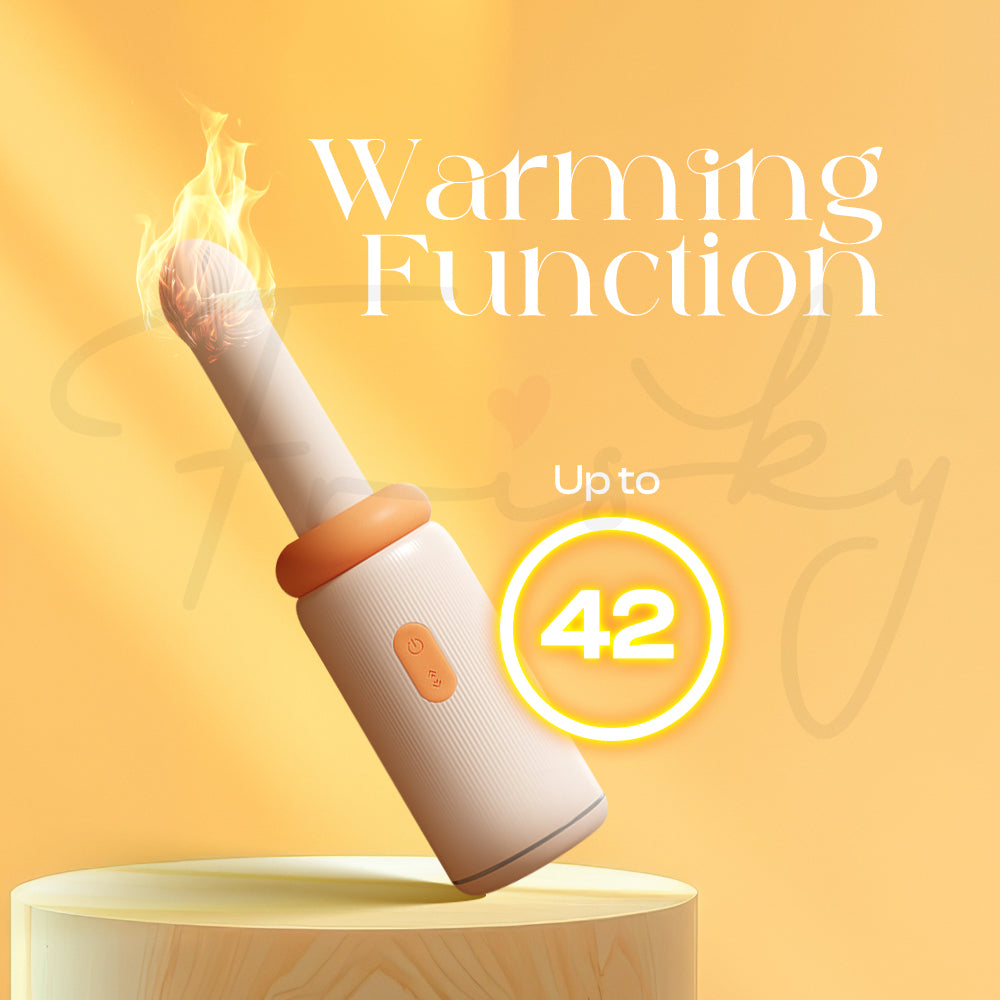 Vibrator displayed standing upright with warm yellow background showing heat feature.