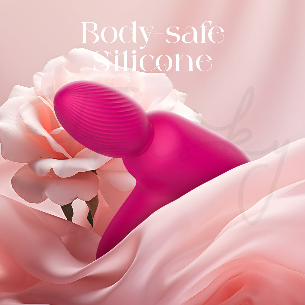Pink silicone massager with floral and fabric background, labeled 'Body-safe Silicone'.