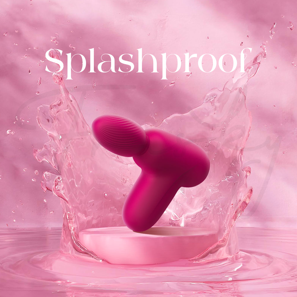 Pink Massage Gun Style Vibrator with Suction with water splashes and 'Splashproof' text on a pink background