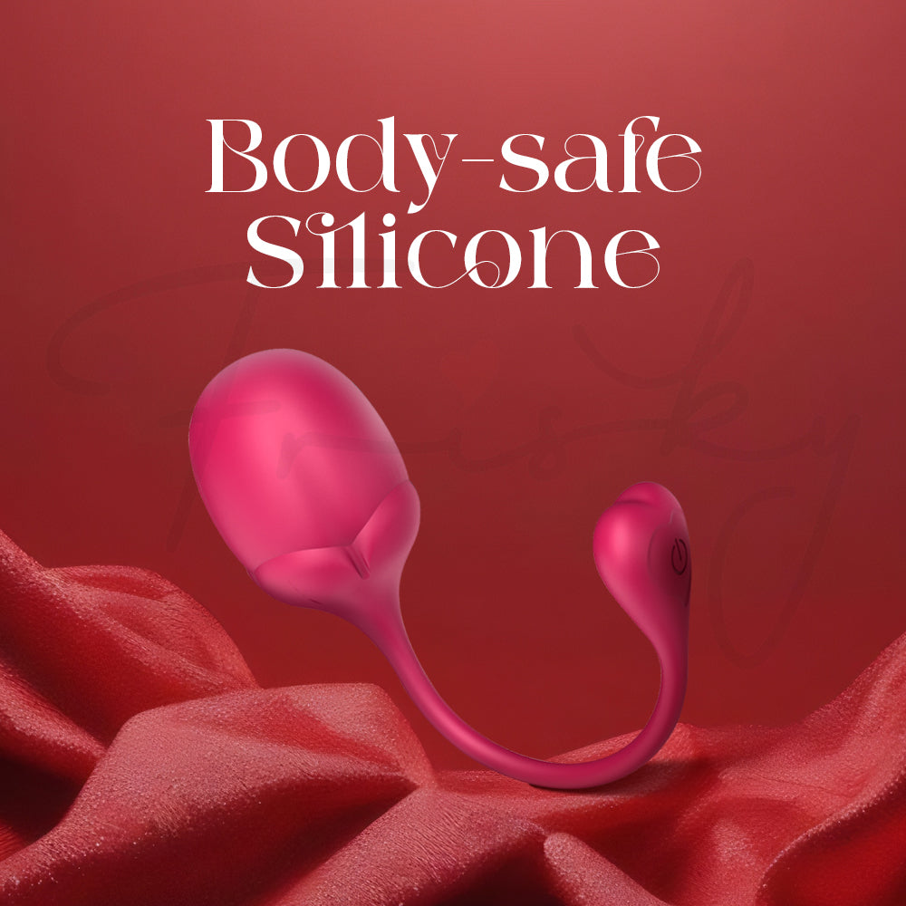 Product shown on red fabric highlighting the smooth, body-safe silicone material