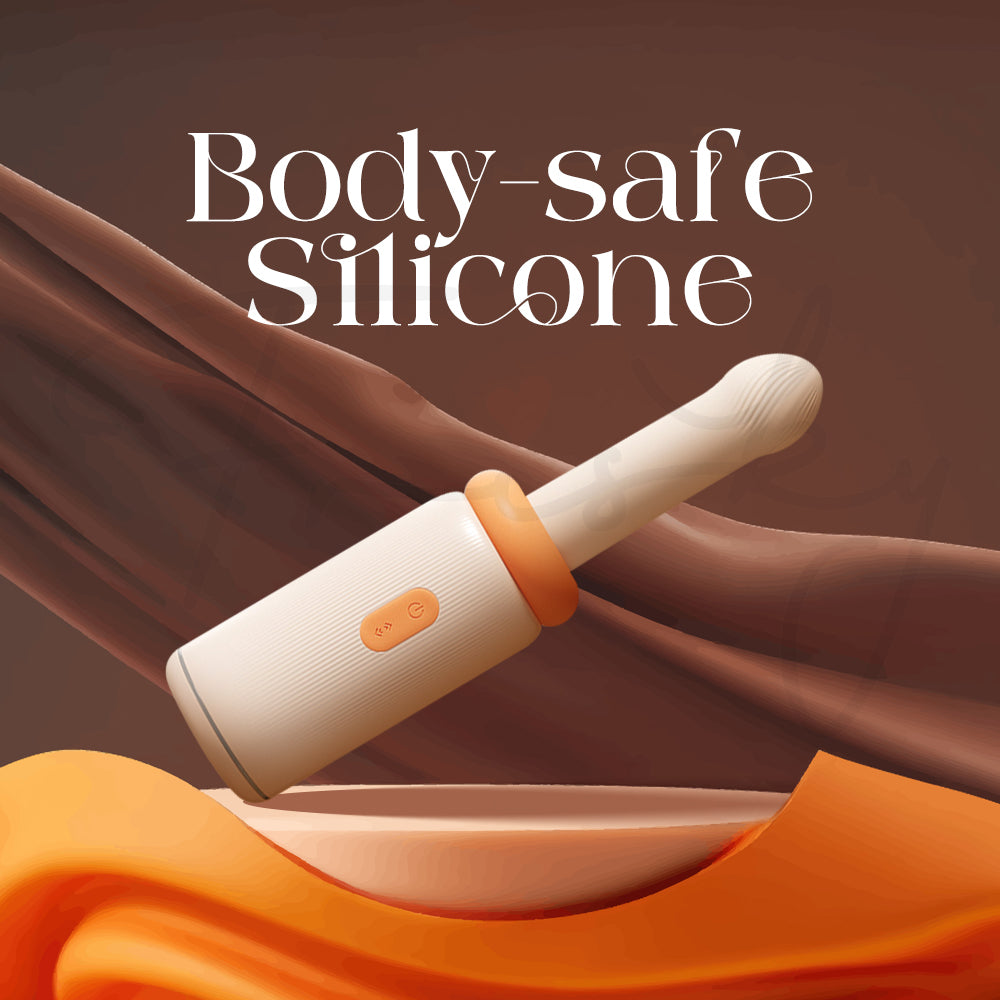 Vibrator displayed on soft fabric emphasizing smooth body-safe silicone surface.