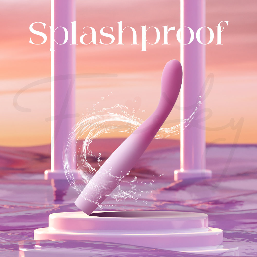 The vibrator positioned over a rippling water surface at sunset, labeled "Splashproof" for easy cleaning.