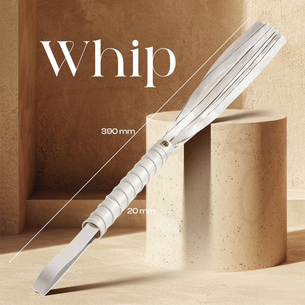 Clear handled whip displayed on stacked wooden blocks with soft studio lighting
