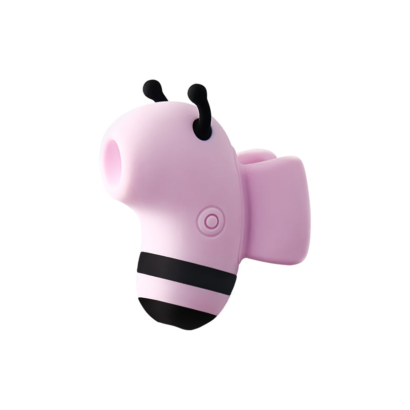 Pink bee-shaped suction stimulator with black antennae and striped body, angled to show its wing