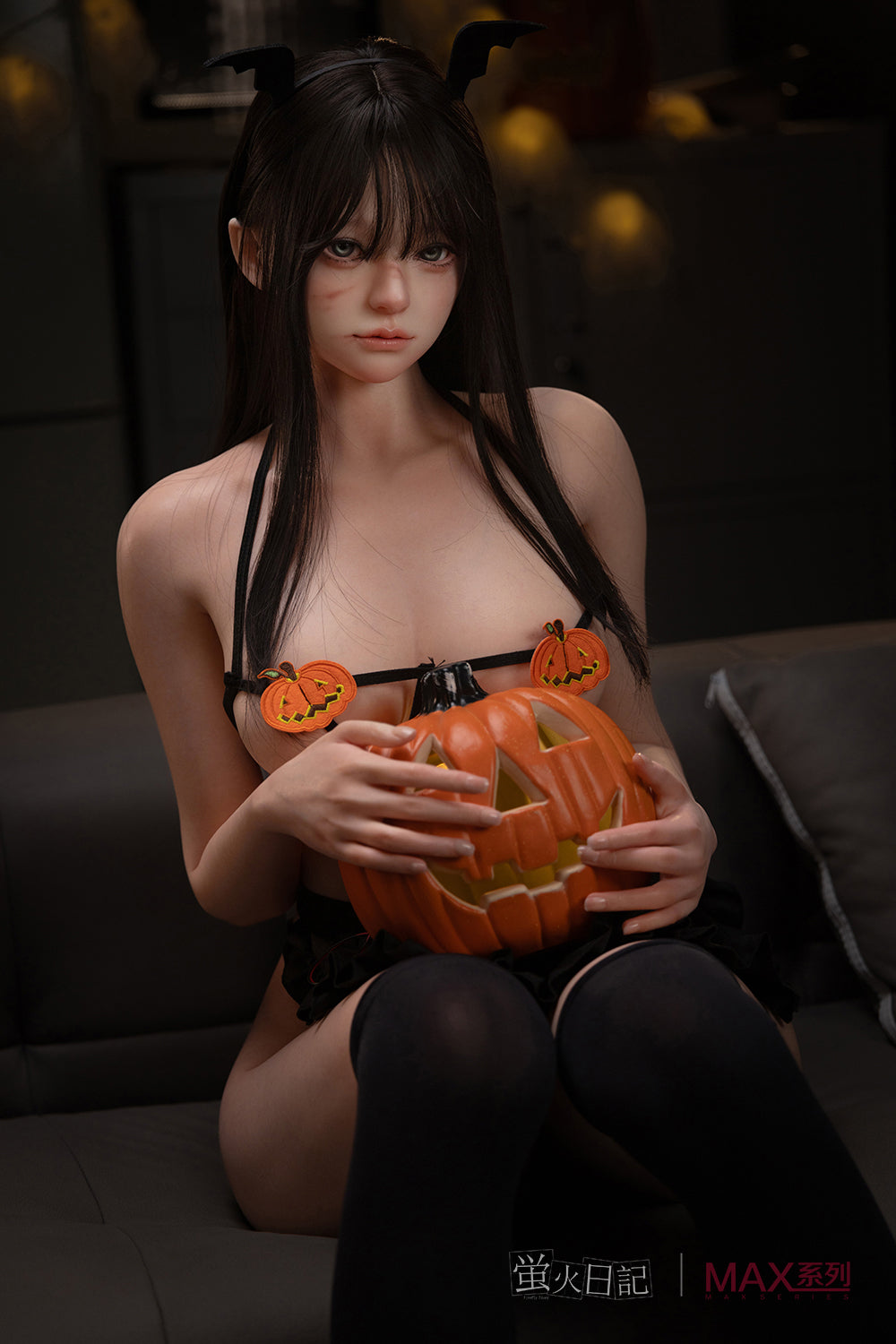 Firefly Diary Doll 165 cm Max Series Silicone – Liuli seated, holding a carved pumpkin while wearing black lingerie and stockings.