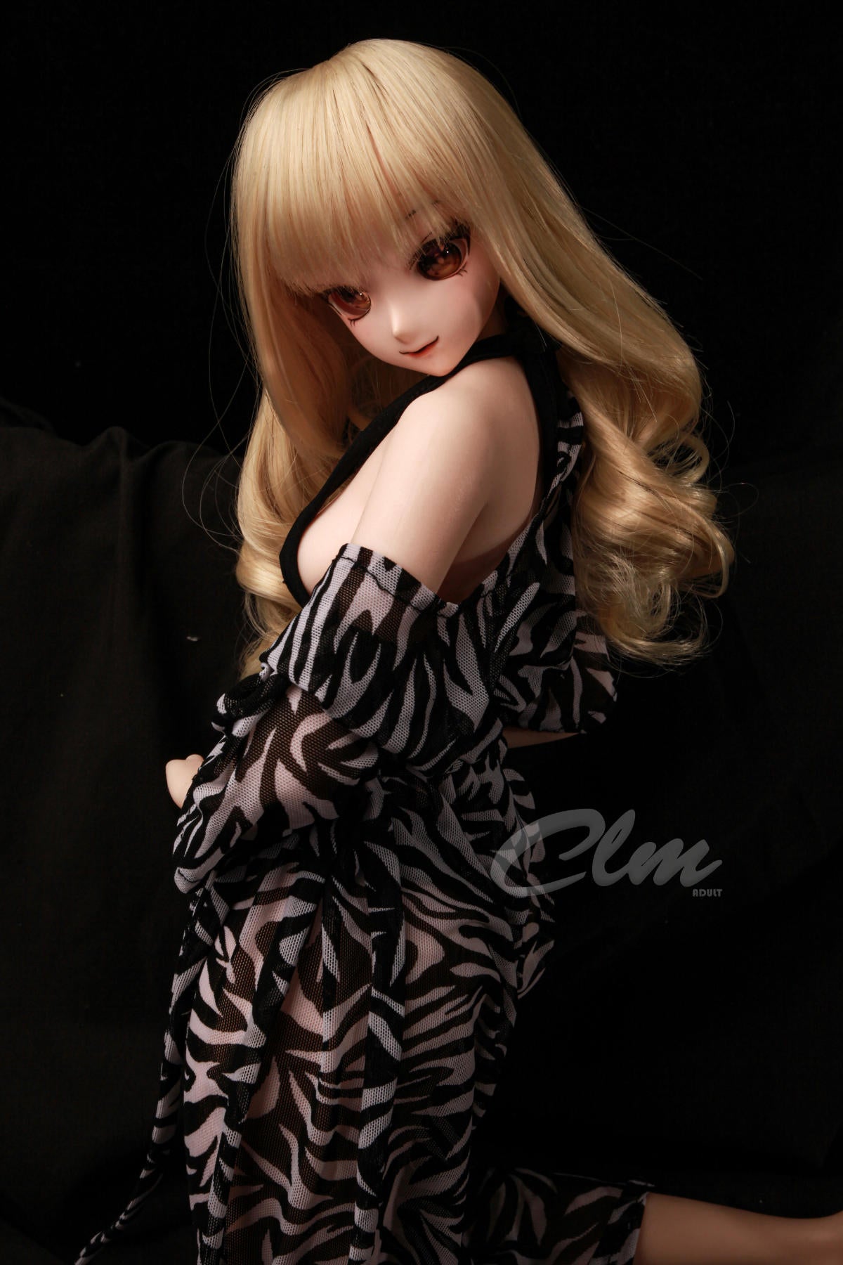 CLIMAX DOLL Mini J60cm XS Hybrid - Nagisa (Cinnamon) standing pose glancing over her shoulder, zebra-print robe draped loosely, black backdrop