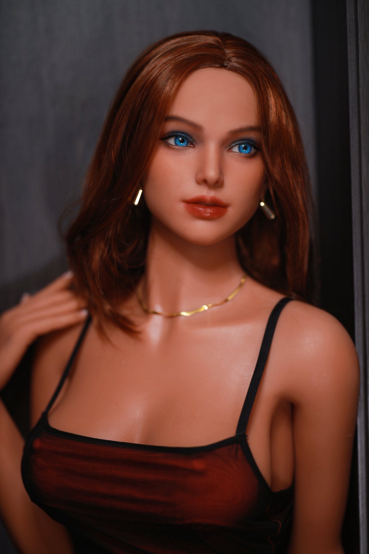 Fire Doll 166 cm C TPE - Casienn close-up upper body shot in red slip dress with gold necklace, long auburn hair, dark indoor background