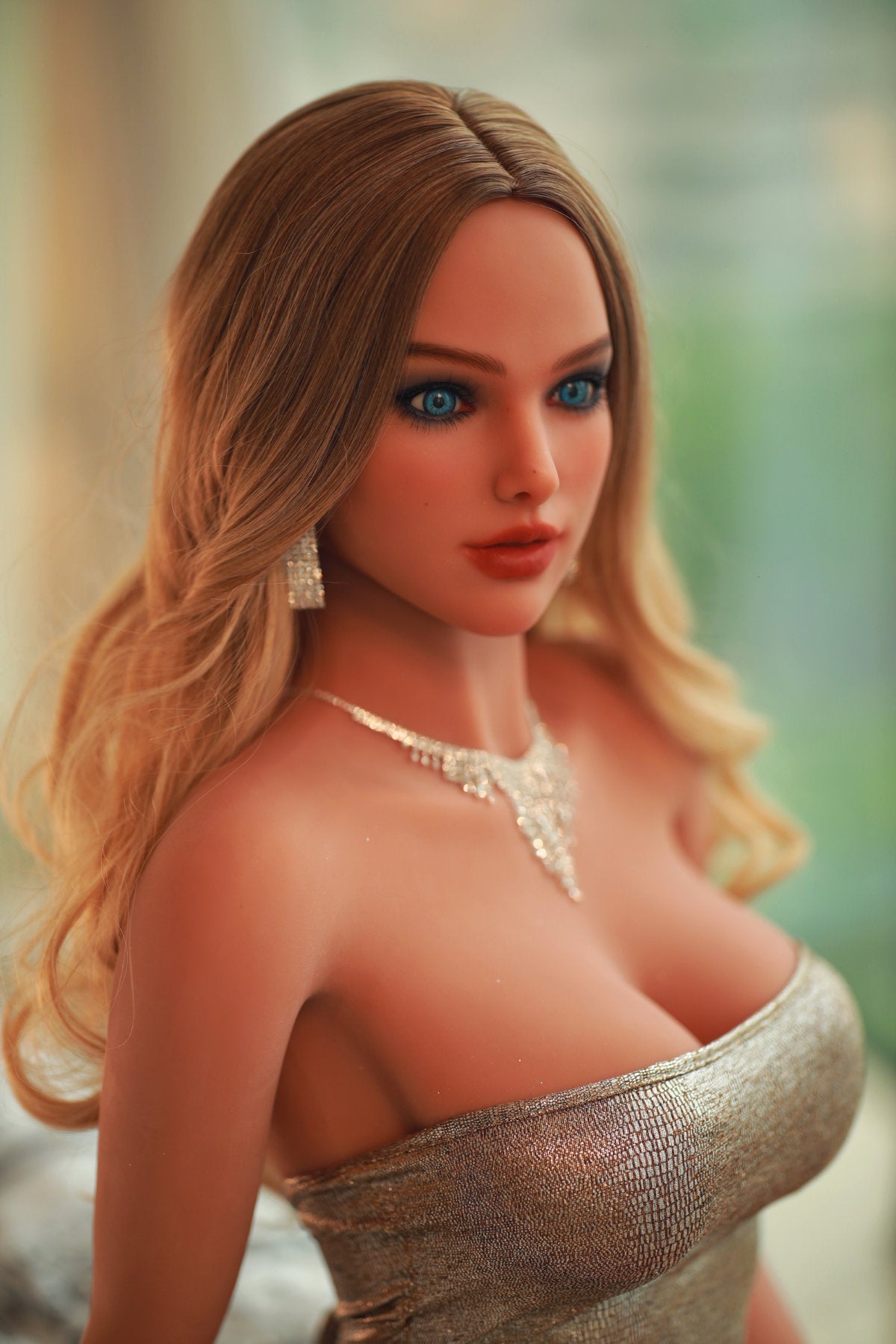 Fire Doll 166 cm C TPE - Swetlya close-up upper body shot in silver metallic dress with pearl necklace, long blonde wavy hair, bright indoor background