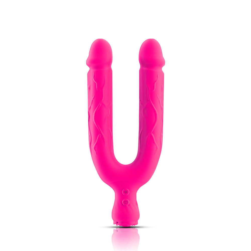 Hot pink U-shaped double-ended dildo vibrator standing upright on its curved base