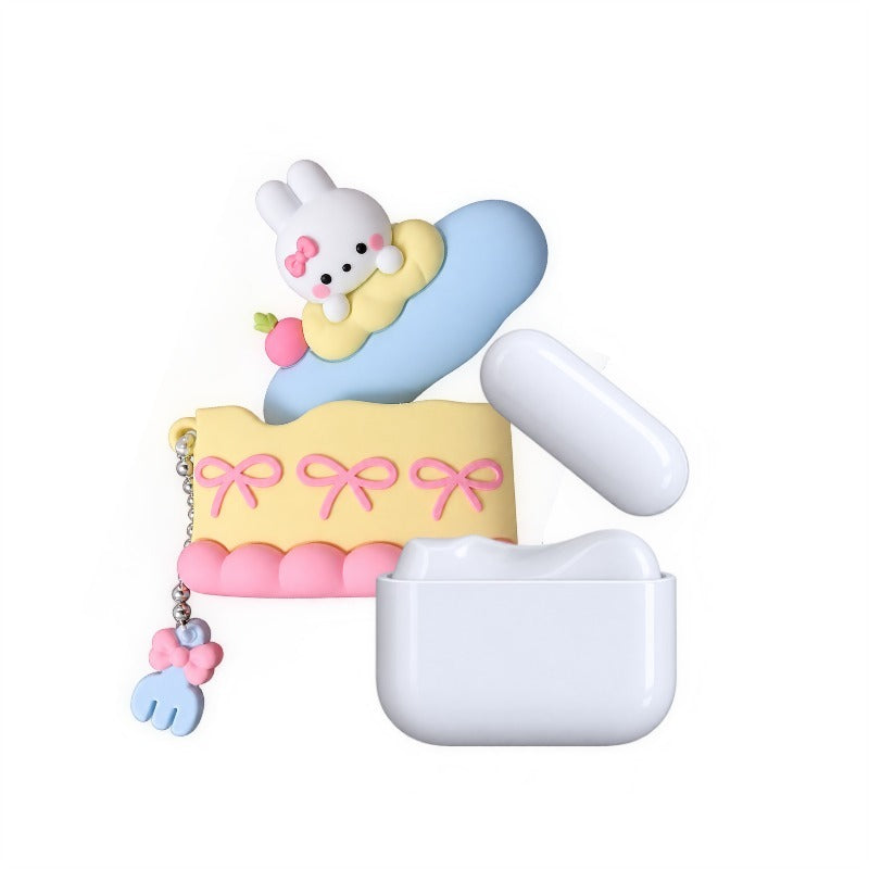 Bunny Cake Pocket Suction Pod, a pastel cake-shaped suction vibrator with bunny topper and blue suction head, beside its white charging case