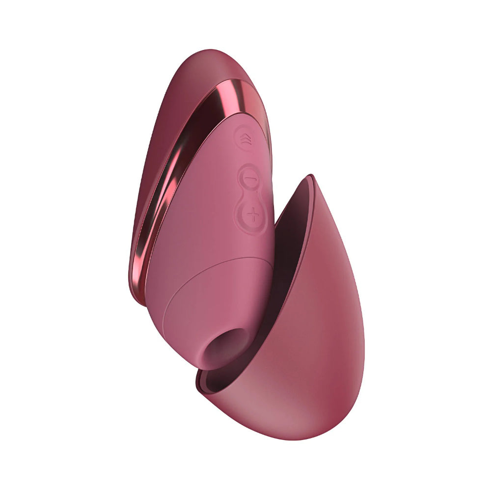 Womanizer Next Liberty clitoral stimulator in burgundy with ergonomic silicone body and Pleasure Air technology.