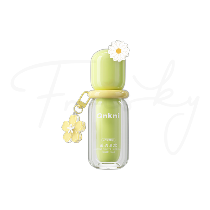 Green lubricant bottle with a flower charm on a plain white background