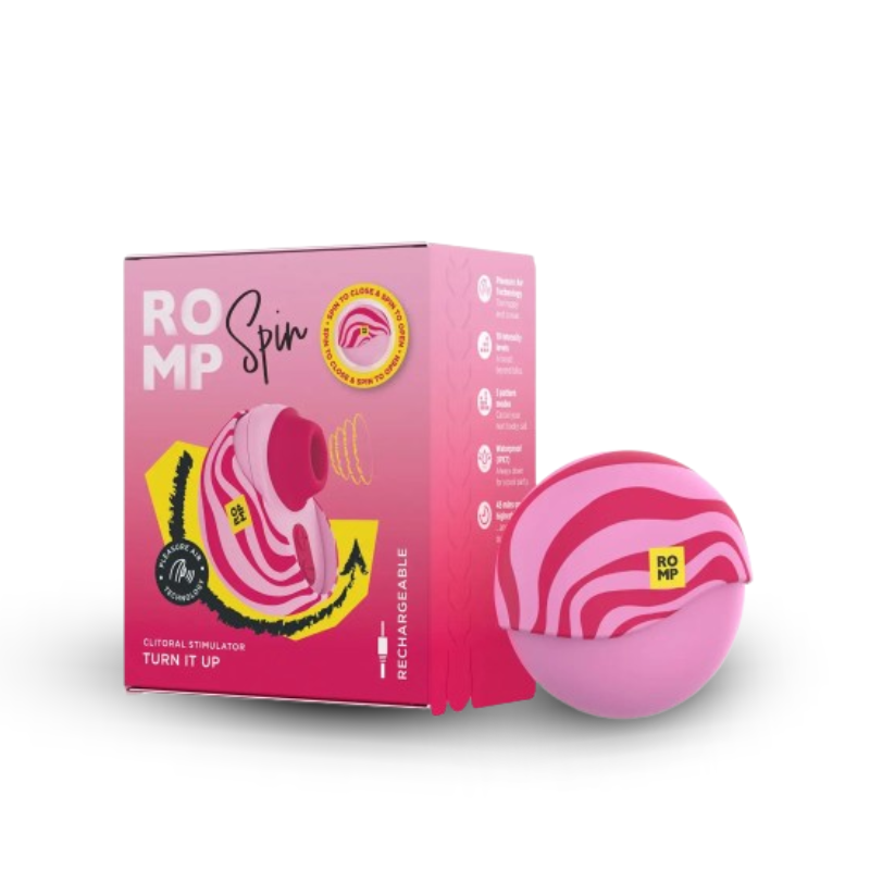 ROMP Spin clitoral stimulator shown beside its pink retail packaging.