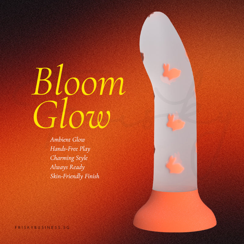 Bloom Glow silicone toy featuring a soft white body and orange base