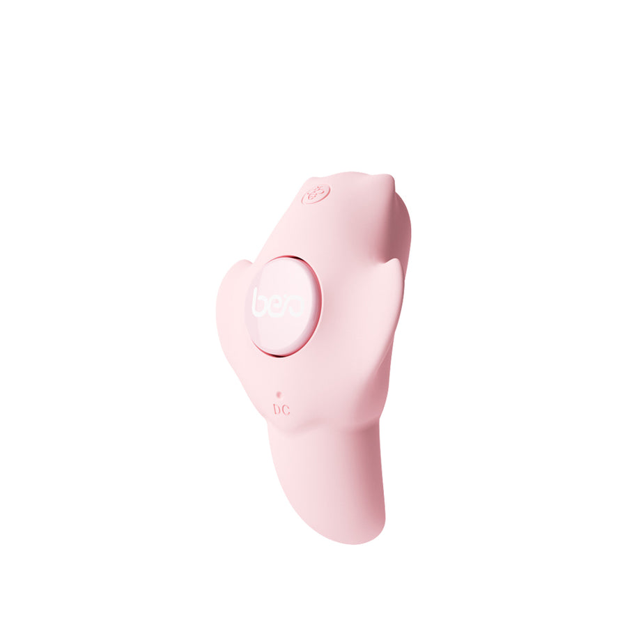 Soft pink wearable vibrator displayed clearly against a plain neutral background