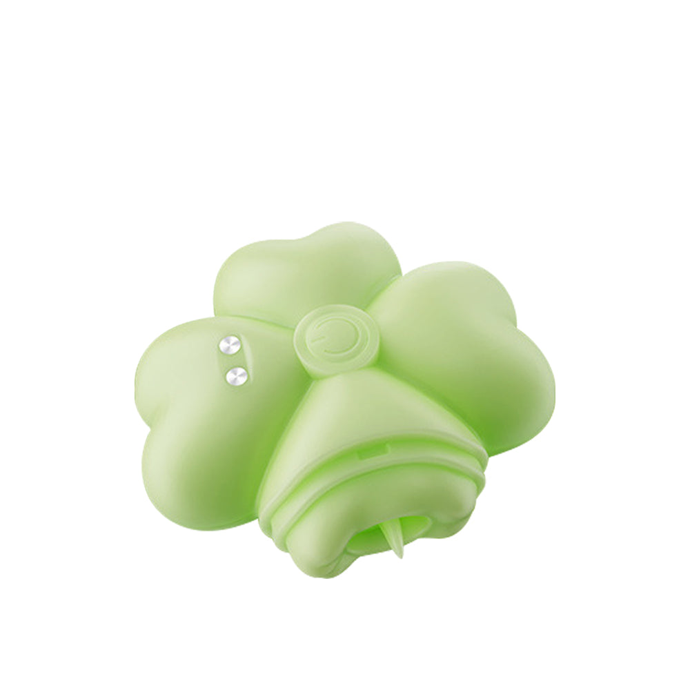 Soft green clover-shaped stimulator with smooth silicone petals and compact rounded body