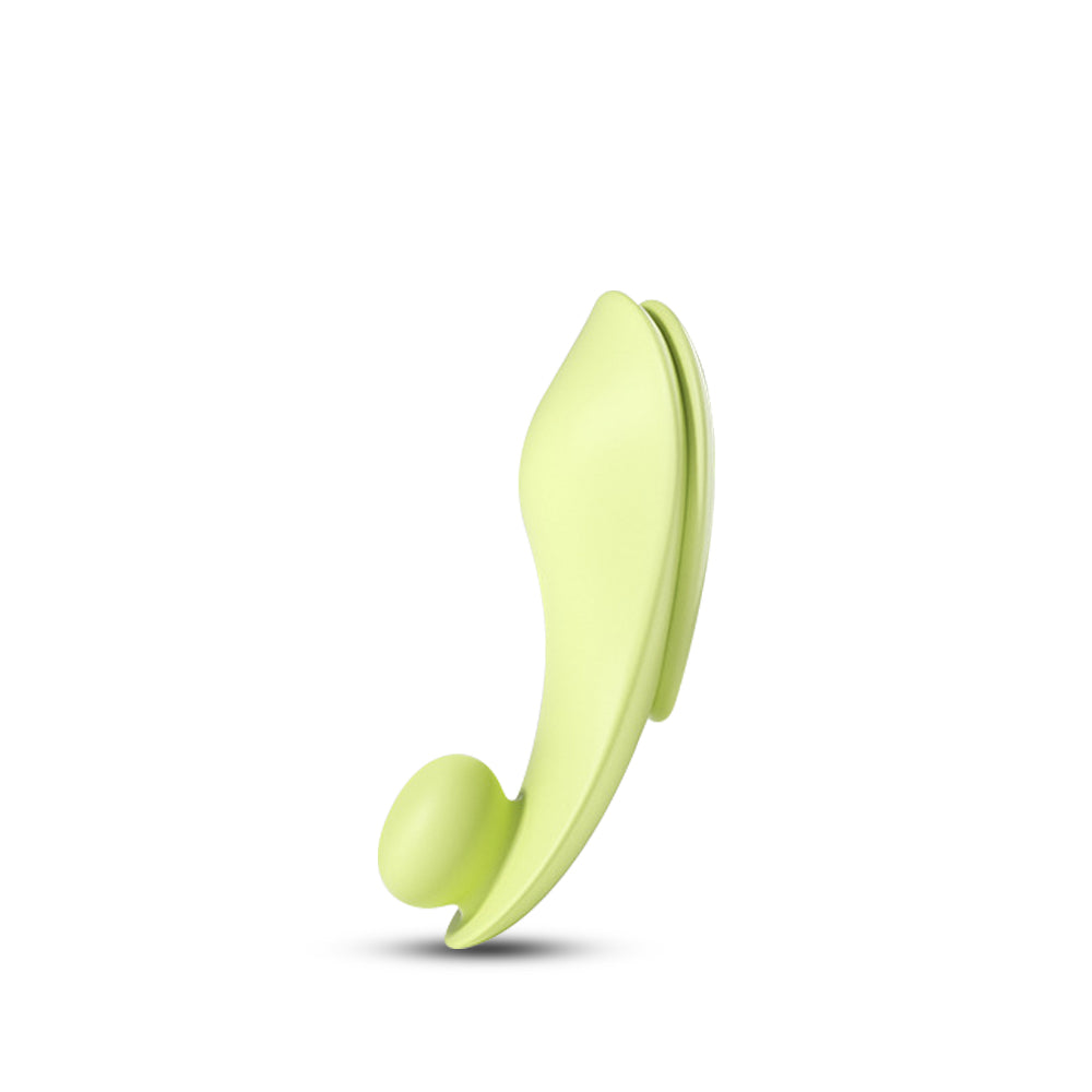 Compact wearable vibrator in light green, ergonomic shape for discreet stimulation