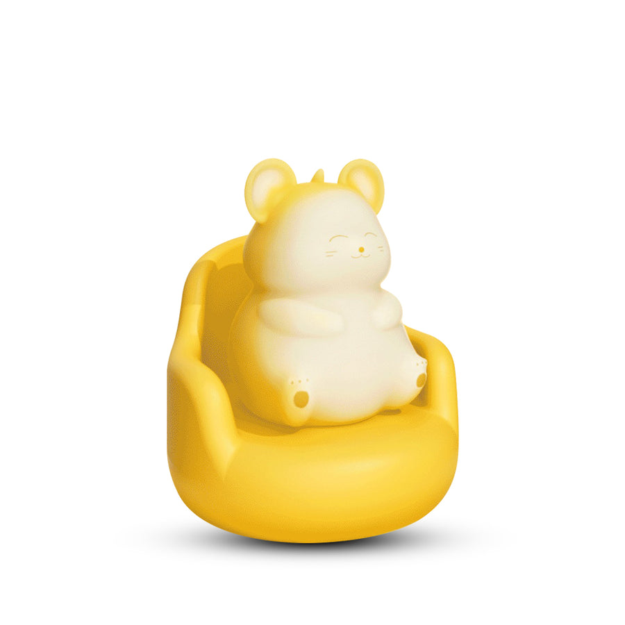 Yellow and white mouse suction vibrator sitting in a yellow chair on a white background