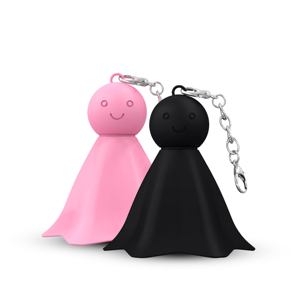 Sunny Buddy compact vibrator displayed on pedestal with warm minimalist background