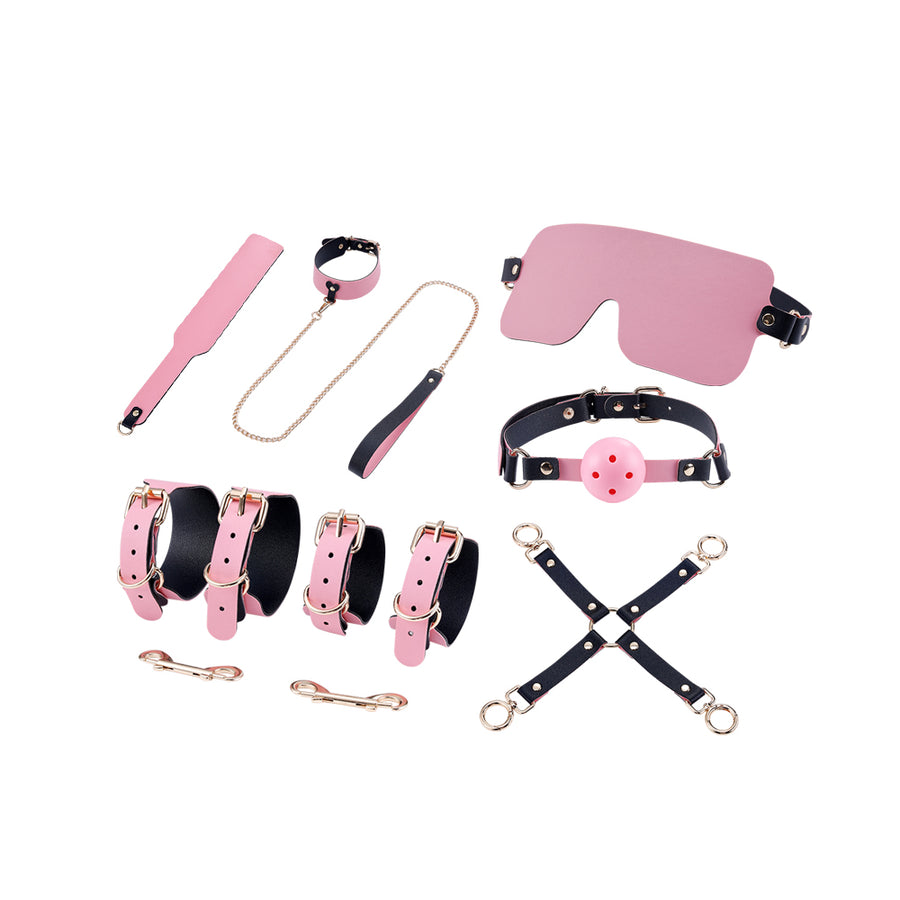 Complete pink and black restraint kit with cuffs, gag, blindfold, leash, paddle, and accessories.