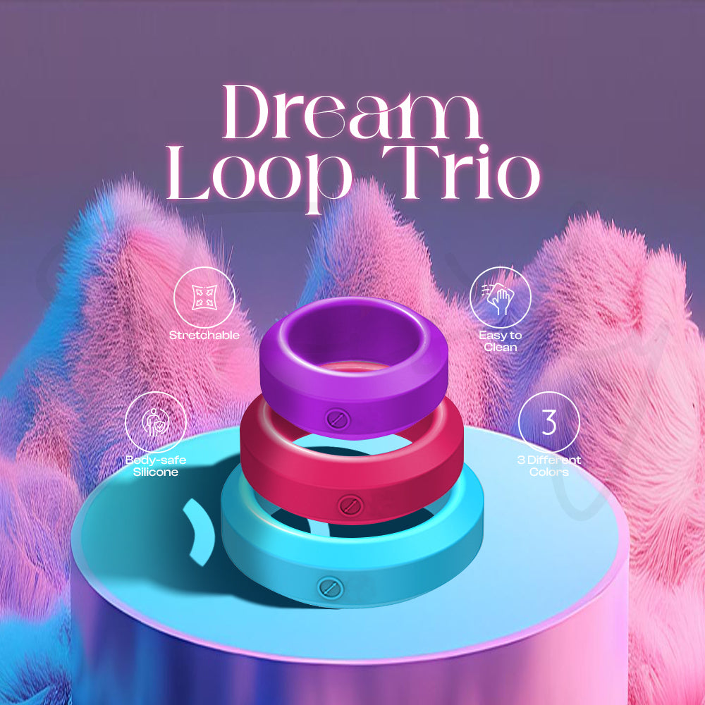 Three pastel silicone rings stacked together on a decorative platform with soft lighting.