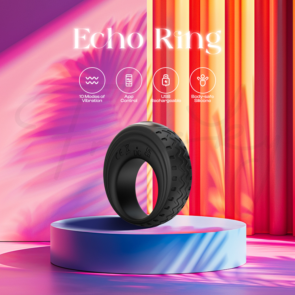 Black vibrating ring displayed on colorful pedestal with pink and purple lighting