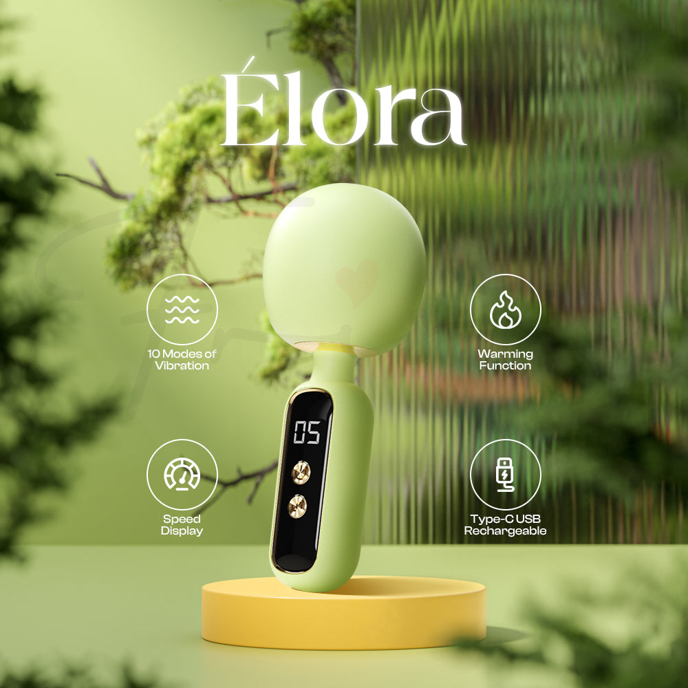 Élora green wand vibrator displayed among lush floral scenery with elegant soft lighting.