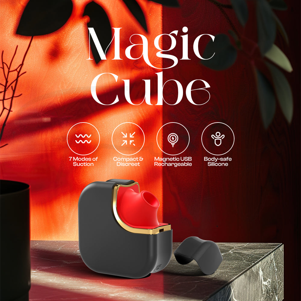 Magic Cube suction vibrator displayed on pedestal in elegant red studio setting