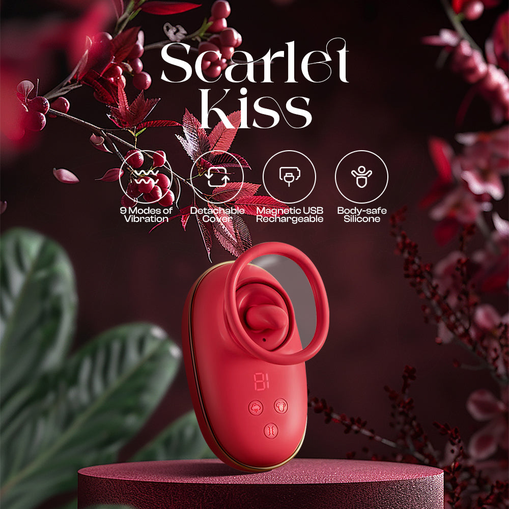 Scarlet Kiss compact red suction vibrator standing upright with floral decorative background
