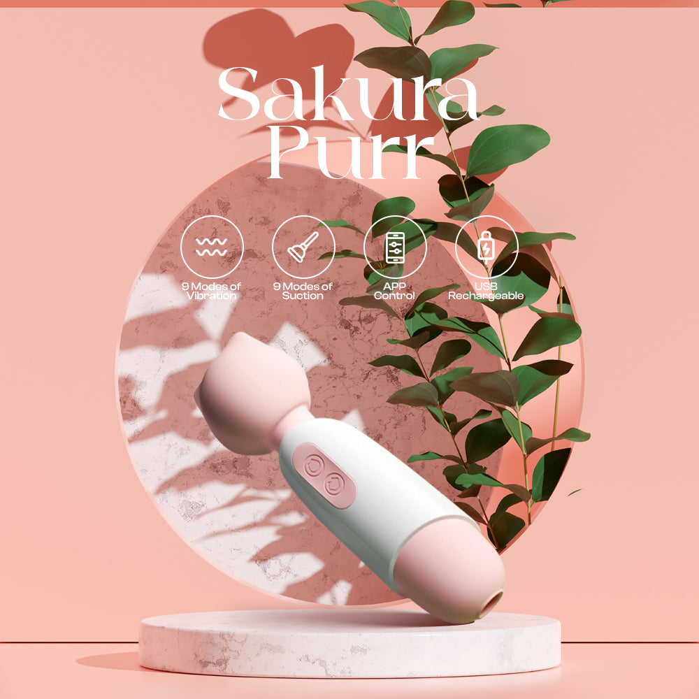 Sakura Purr wand displayed among soft greenery with a cherry-blossom themed backdrop