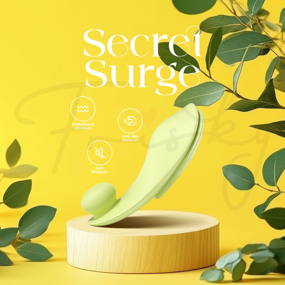 Secret Surge wearable vibrator displayed with elegant leaves and soft lighting