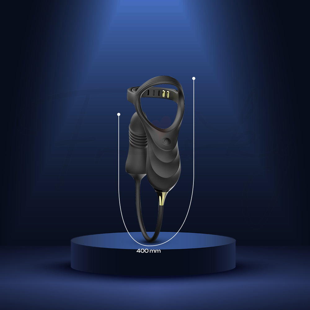 Black Alpha Ring massager presented on pedestal with elegant spotlight background.