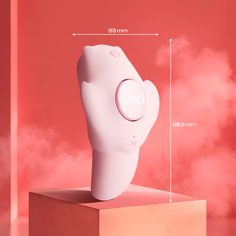 Upright pink wearable vibrator displayed on a soft pink pedestal setting