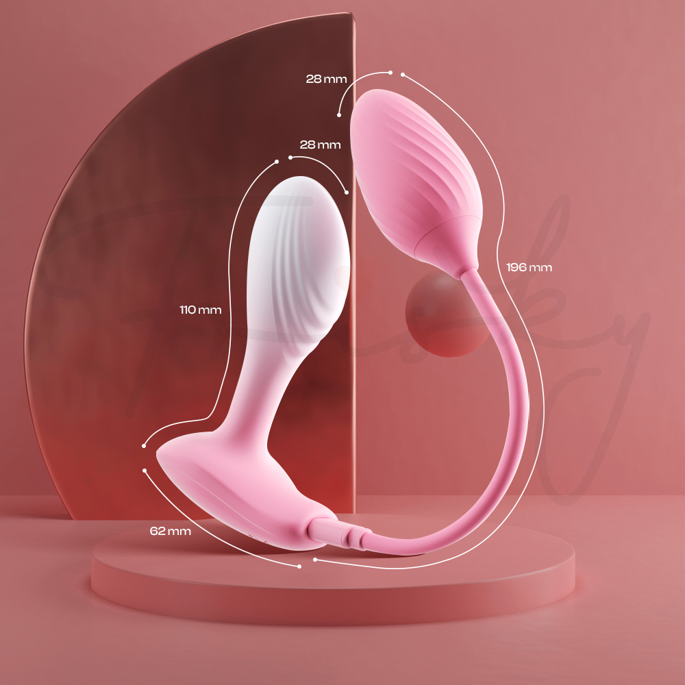 Cotton Elf plug and egg vibrator displayed upright on a stand showing size dimension.