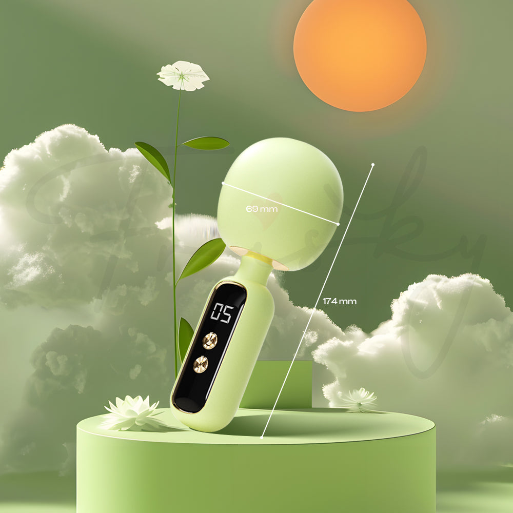 Élora Mini AV Vibrator displayed on pastel green stand under bright sunlight.