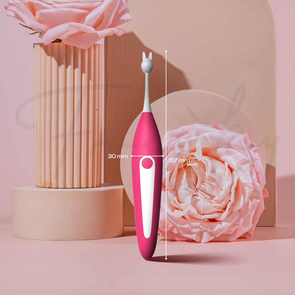 Rosy Pulse slim rechargeable vibrator displayed in modern pink lifestyle setting