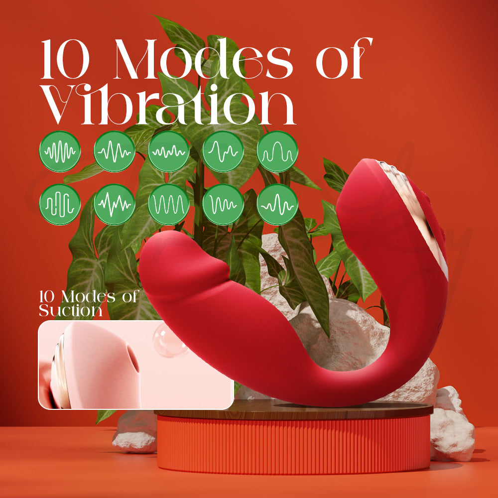 Red dual-ended vibrator standing upright on an orange surface highlighting its vibration modes