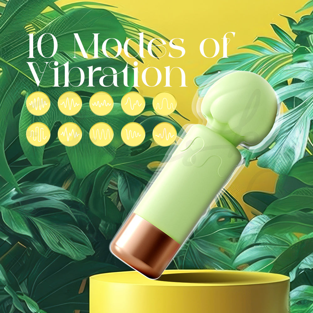 Mini green vibrator upright on a glossy surface highlighting its ten vibration modes.”