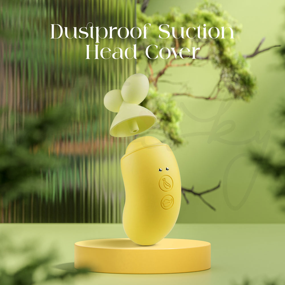 Yellow BanaRush vibrator outdoors with its dustproof suction head cover highlighted against a leafy environment.