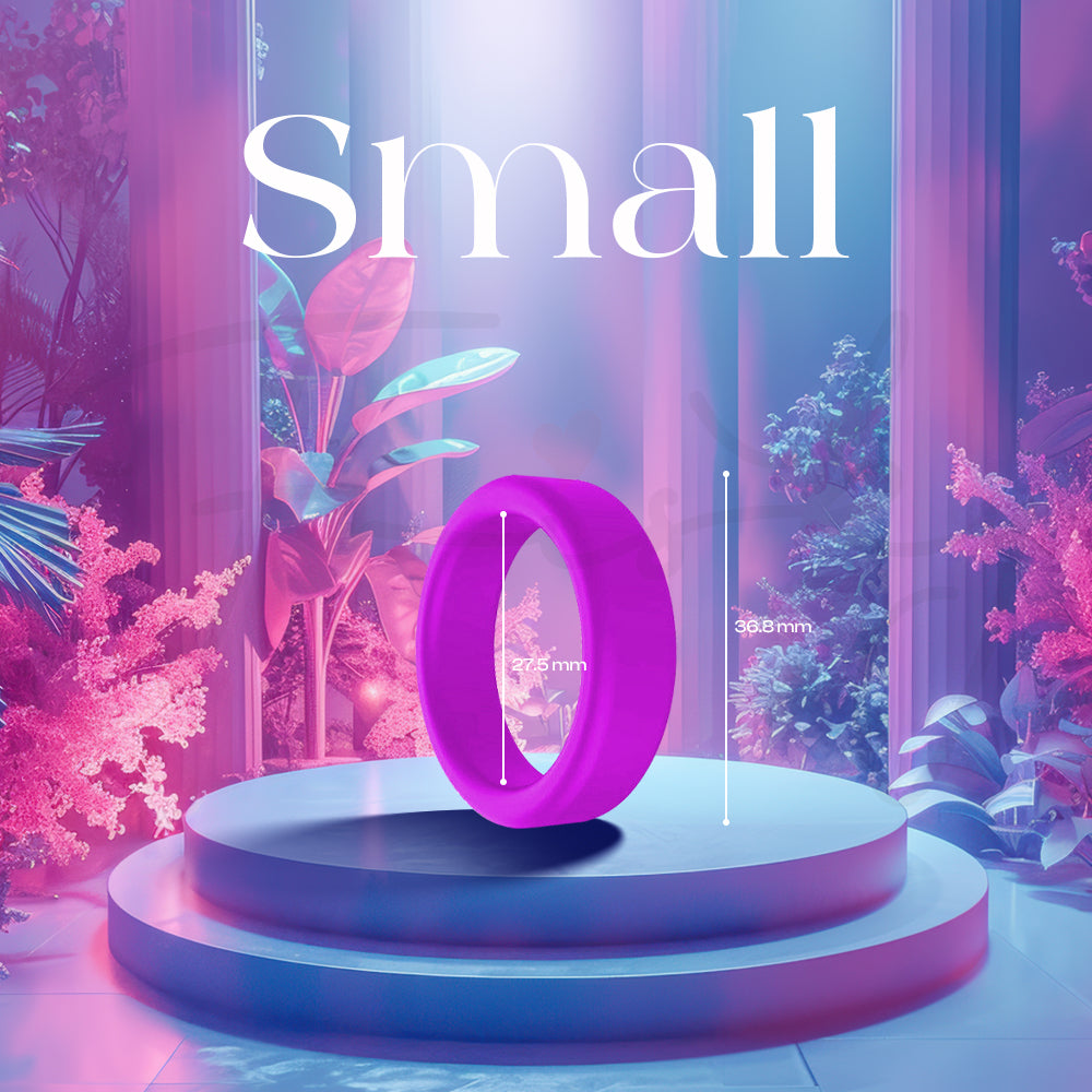 A small purple silicone ring displayed upright on a softly lit pedestal.