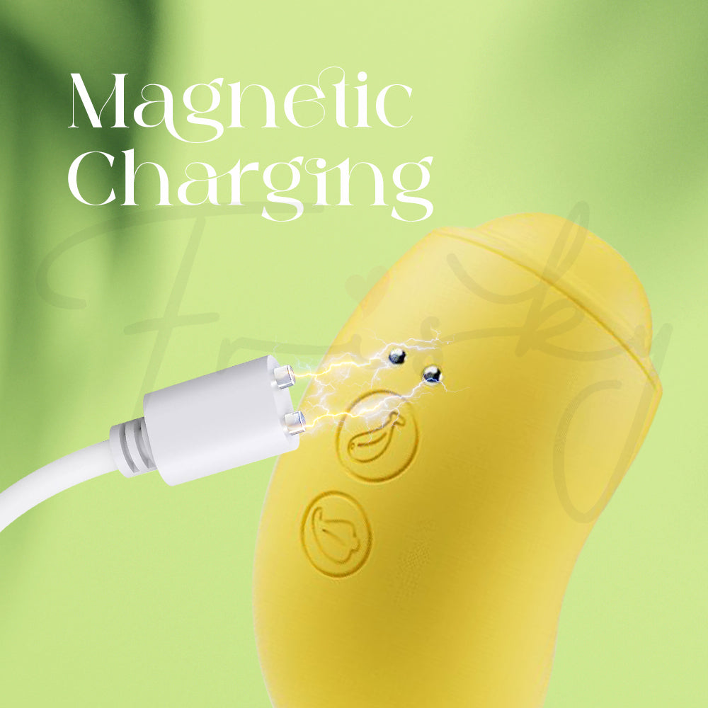 Close-up of the BanaRush vibrator being connected to its magnetic charging cable against a soft green background.