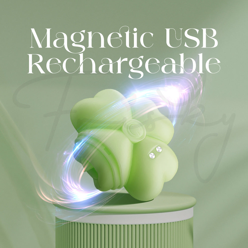 Close-up of stimulator’s magnetic USB charging connection on smooth green surface.