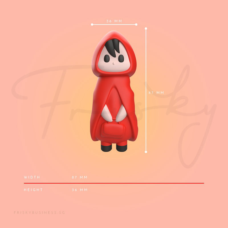 Red hooded character figurine with measurements on a pink background