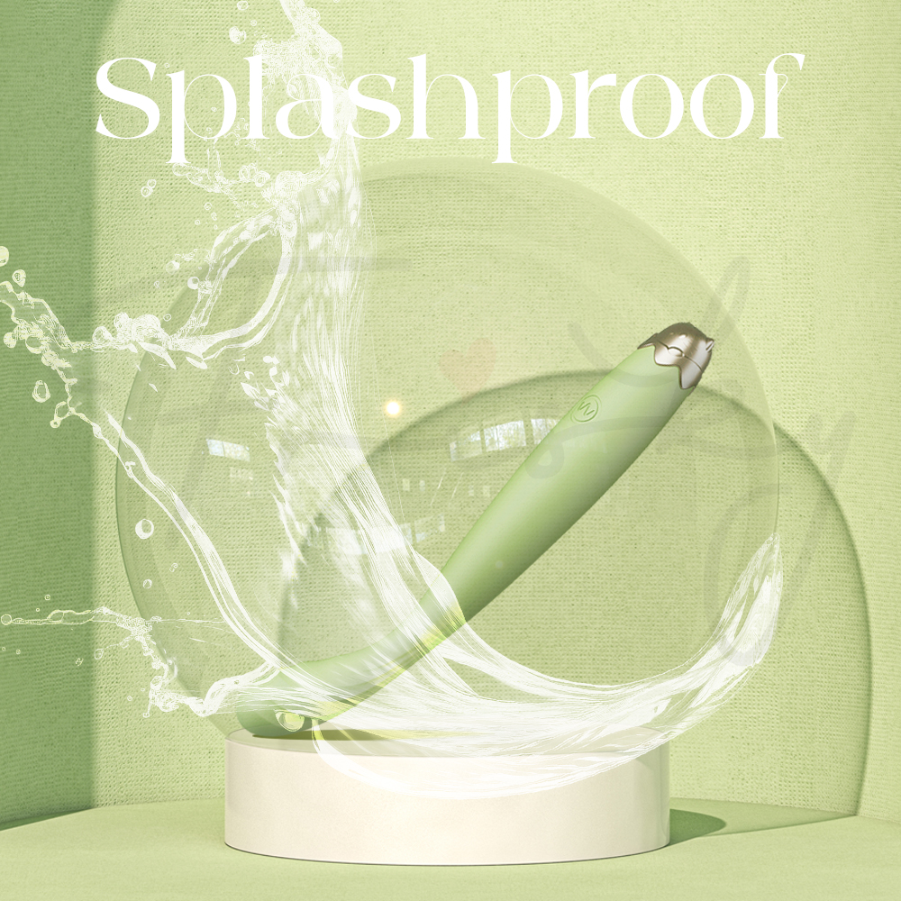 Numi vibrator being splashed with water, highlighting its splashproof design.