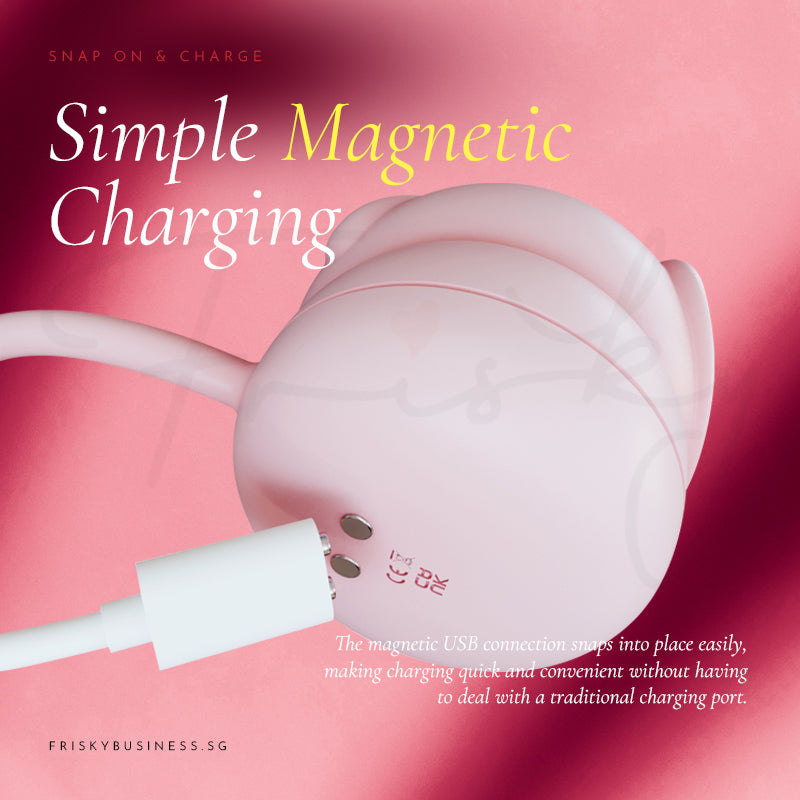Stimulator shown with its white magnetic charging cable attached